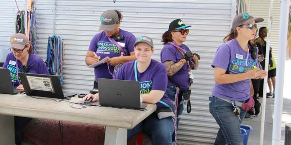 Employees at a pet adoption event